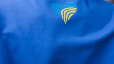 woman blue sports wear standing outside by building scaled 1